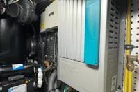 Engine room of 2007 Trader 42 HT yacht with electrical equipment and wiring.