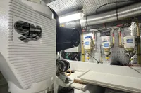 Engine room of 2007 Trader 42 HT yacht, showcasing mechanical components and filtration systems.