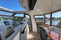Luxurious interior of 2007 Trader 42 HT yacht with scenic water views.