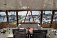 Interior view of 2007 Trader 42 HT yacht with marina backdrop.