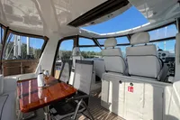 Luxurious interior of 2007 Trader 42 HT yacht with seating and table.