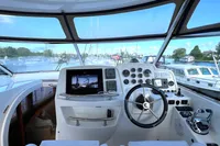 Helm of 2007 Trader 42 HT yacht with modern controls and panoramic view.