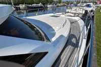 2007 Trader 42 HT yacht docked at marina, showcasing sleek design and spacious deck.