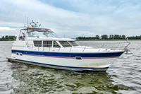 2007 Trader 42 HT yacht on calm water, featuring sleek design and modern amenities.