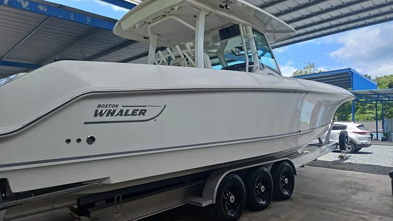 Yacht Photos Pics 2017 Boston Whaler 380 Outrage boat on trailer in covered storage area.