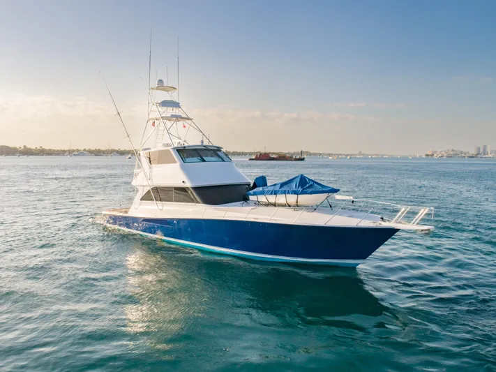 Killin Time Yacht Photos Pics 2003 Viking 65 Convertible Enclosed Bridge yacht on open water.