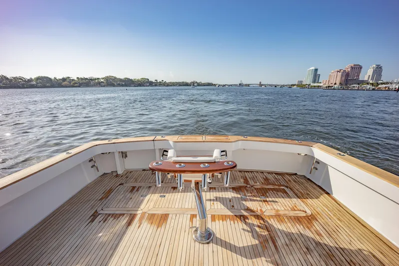 Killin Time Yacht Photos Pics 2003 Viking 65 Convertible Enclosed Bridge yacht deck overlooking calm waters.