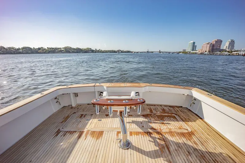 Killin Time Yacht Photos Pics 2003 Viking 65 Convertible Enclosed Bridge yacht deck with scenic waterfront view.