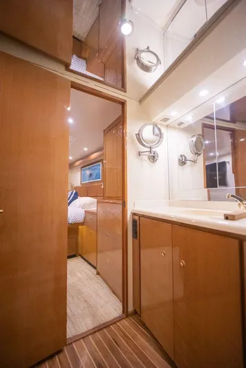 Killin Time Yacht Photos Pics 2003 Viking 65 Convertible Enclosed Bridge interior with wood cabinetry and modern fixtures.