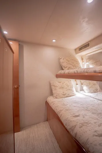 Killin Time Yacht Photos Pics Interior of 2003 Viking 65 Convertible Enclosed Bridge with cozy bunk beds.