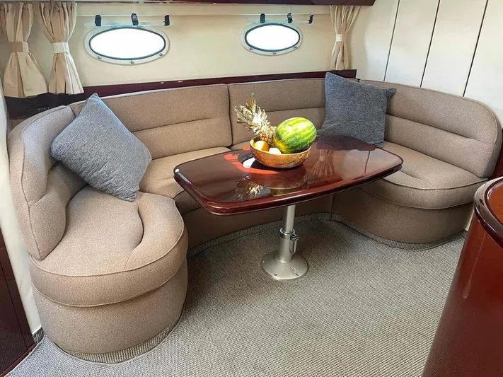  Yacht Photos Pics Luxurious 2006 Princess V42 yacht interior with cozy seating and fruit centerpiece.