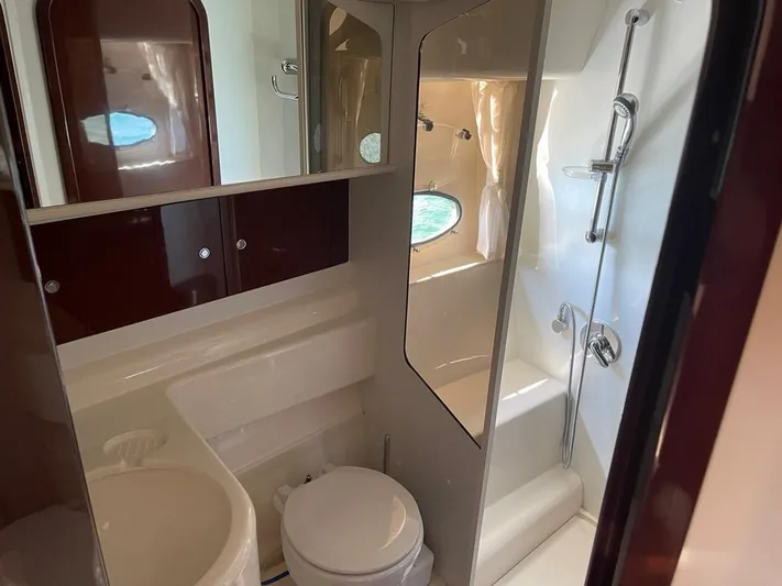  Yacht Photos Pics Luxurious bathroom in 2006 Princess V42 yacht with modern fixtures and elegant design.