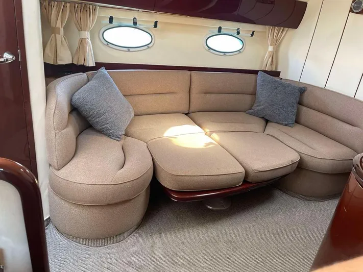  Yacht Photos Pics Luxurious interior of a 2006 Princess V42 yacht with plush seating and porthole windows.