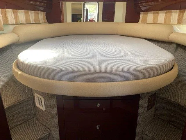  Yacht Photos Pics Interior cabin of 2006 Princess V42 yacht with circular bed and elegant design.