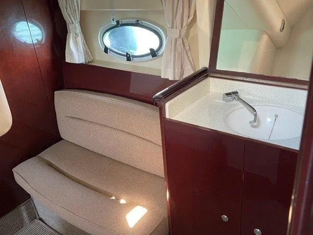  Yacht Photos Pics Interior of 2006 Princess V42 yacht with seating, porthole, and sink.
