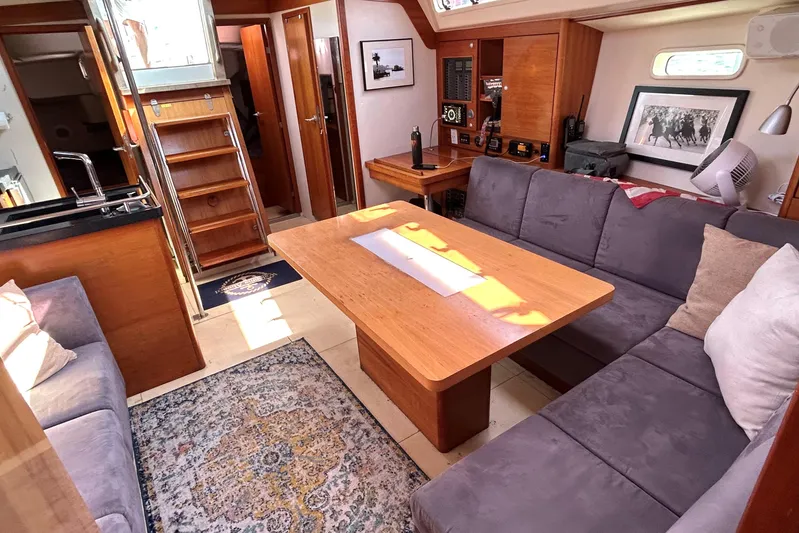 Scacciapensieri Yacht Photos Pics Interior of 2008 Hanse 470e yacht with cozy seating and wooden finishes.