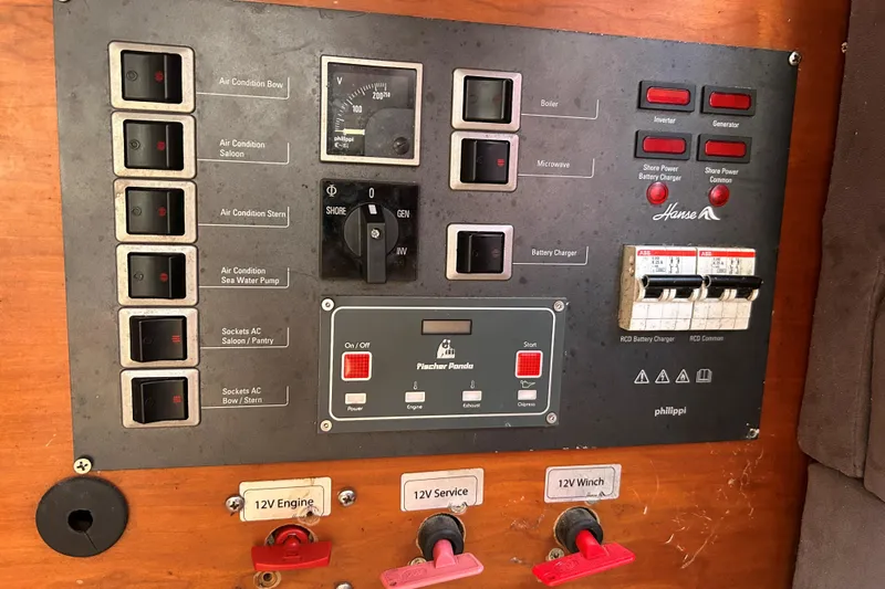 Scacciapensieri Yacht Photos Pics Control panel of a 2008 Hanse 470e yacht with various switches and gauges.