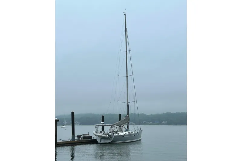 Scacciapensieri Yacht Photos Pics Sailboat Hanse 470e (2008) docked on a misty day, calm waters.