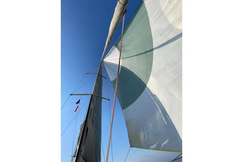 Scacciapensieri Yacht Photos Pics Sailing yacht Hanse 470e, 2008 model, with sails unfurled against a clear blue sky.