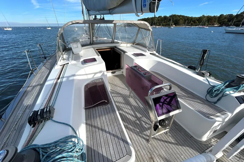 Scacciapensieri Yacht Photos Pics 2008 Hanse 470e sailboat cockpit with teak decking, moored on a sunny day.