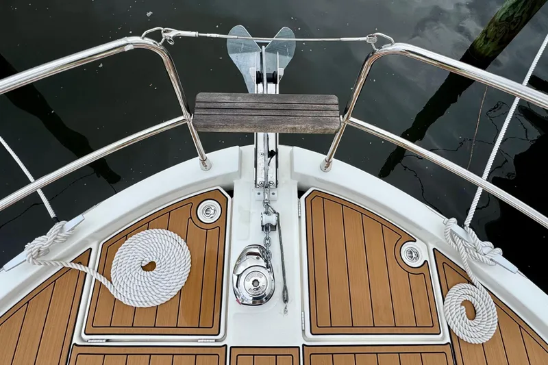 Yacht Photos Pics Bow view of 2025 Beneteau Swift Trawler 35 with teak deck and anchor.