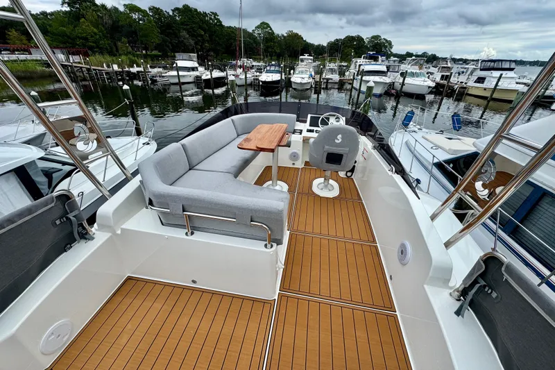  Yacht Photos Pics 2025 Beneteau Swift Trawler 35 with spacious deck and seating at marina.