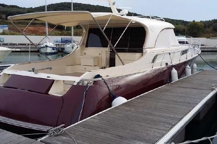  Yacht Photos Pics Luxury 2004 Mochi Craft Dolphin 51' yacht docked at marina.