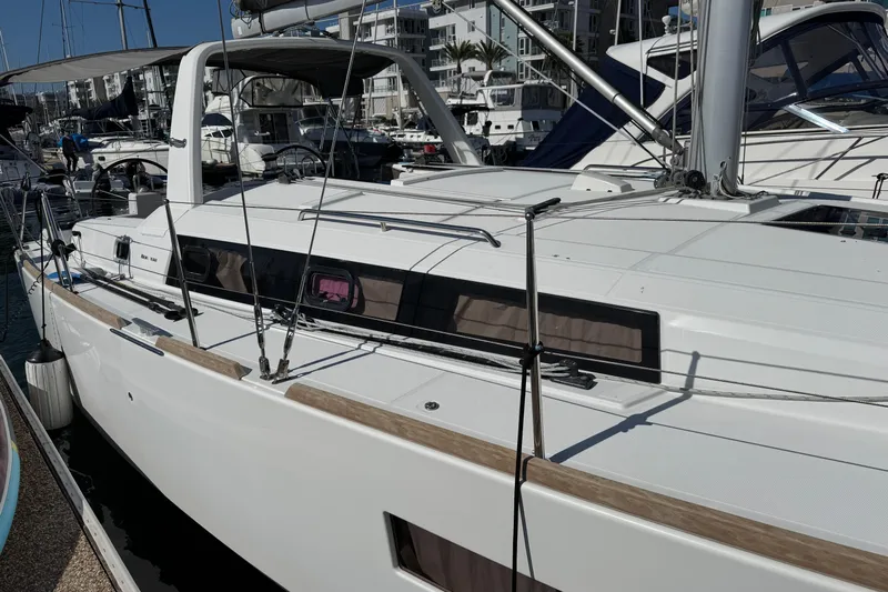Moonraker Yacht Photos Pics 2014 Beneteau Oceanis 38 sailboat docked in marina, showcasing sleek design and modern features.