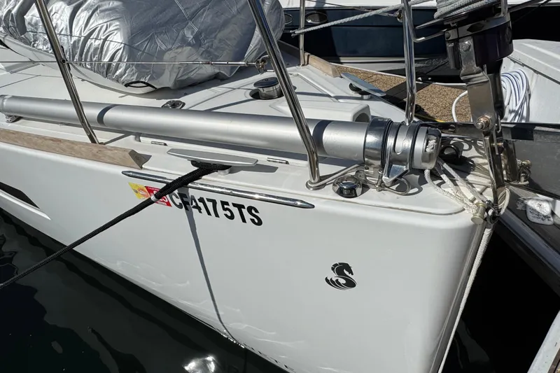 Moonraker Yacht Photos Pics 2014 Beneteau Oceanis 38 sailboat bow with mooring lines and logo.