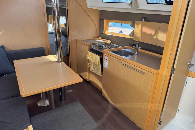 Moonraker Yacht Photos Pics Interior of 2014 Beneteau Oceanis 38 yacht with modern kitchen and dining area.