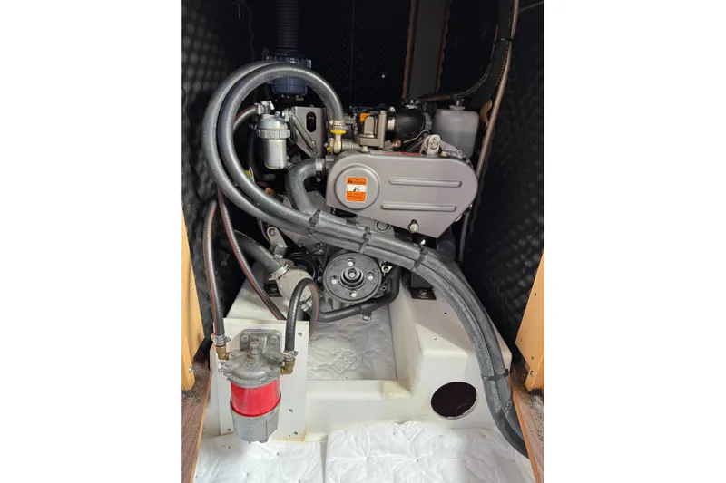Moonraker Yacht Photos Pics Engine compartment of a 2014 Beneteau Oceanis 38 sailboat, showcasing mechanical components.