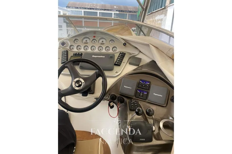  Yacht Photos Pics 2008 Cranchi Zaffiro 36 boat dashboard with steering wheel and Raymarine navigation system.
