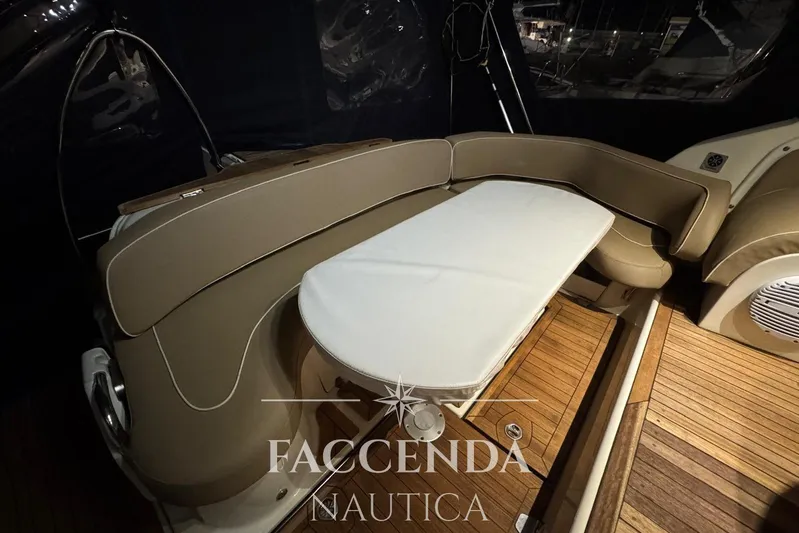  Yacht Photos Pics 2008 Cranchi Zaffiro 36 yacht interior with beige seating and wooden flooring.
