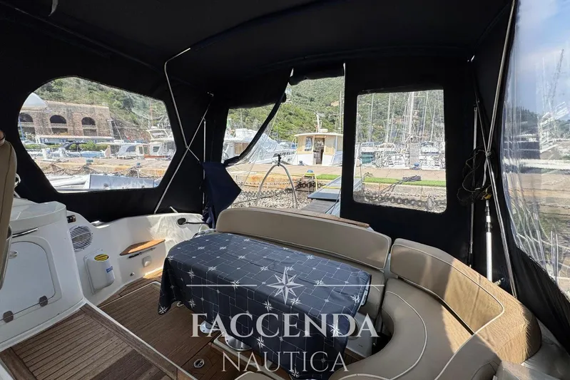  Yacht Photos Pics Interior view of 2008 Cranchi Zaffiro 36 yacht with covered seating area.