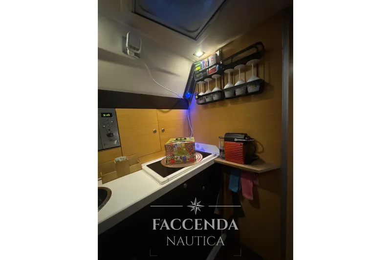  Yacht Photos Pics Compact kitchen area in 2008 Cranchi Zaffiro 36 yacht with modern amenities.