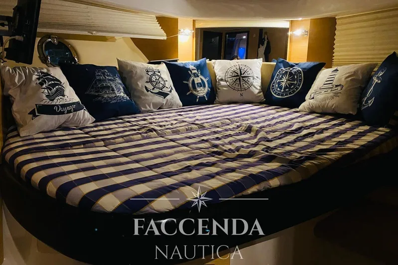 Yacht Photos Pics Luxurious cabin interior of 2008 Cranchi Zaffiro 36 with nautical-themed pillows.