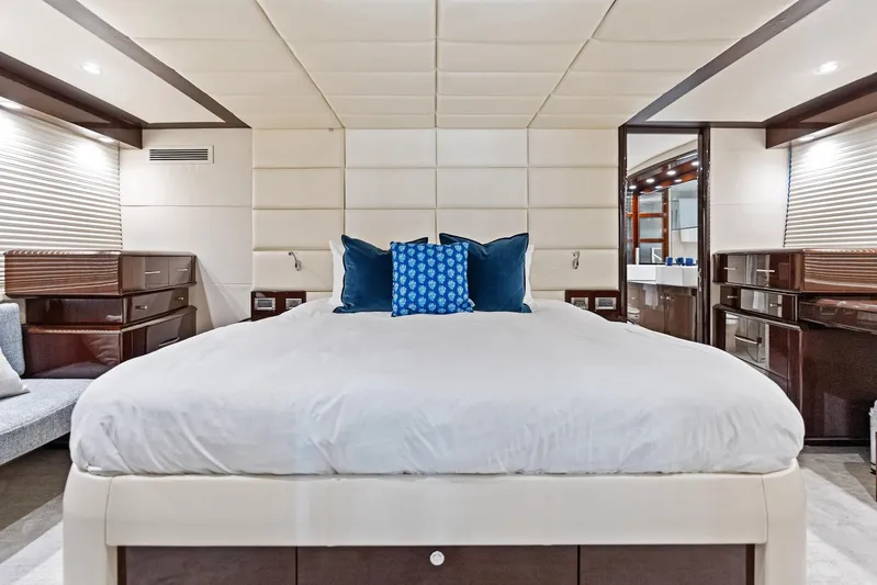 Liquid Asset Yacht Photos Pics Luxurious bedroom interior of 2010 Lazzara 78 Fly yacht with modern design and plush bedding.