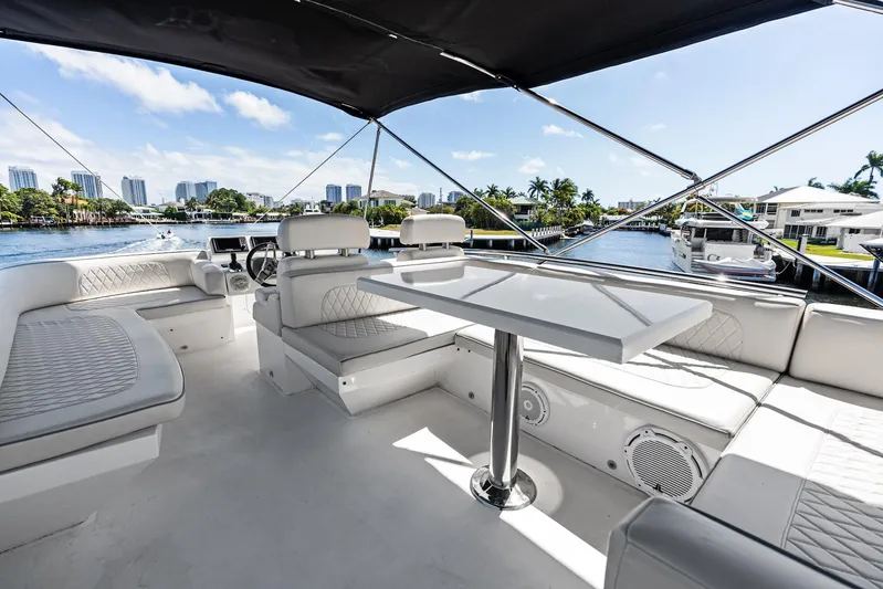 Liquid Asset Yacht Photos Pics Luxurious 2010 Lazzara 78 Fly yacht interior with elegant seating and scenic waterfront view.