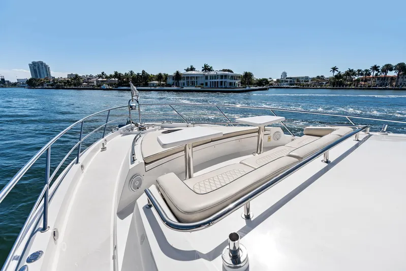 Liquid Asset Yacht Photos Pics 2010 Lazzara 78 Fly yacht with spacious deck, cruising on a sunny day.