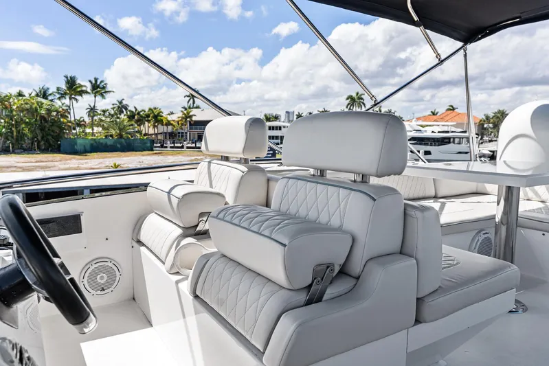 Liquid Asset Yacht Photos Pics Luxurious seating on 2010 Lazzara 78 Fly yacht with elegant white upholstery.