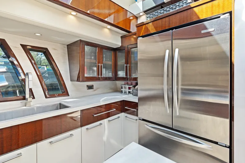 Liquid Asset Yacht Photos Pics Luxurious kitchen interior of 2010 Lazzara 78 Fly yacht with modern appliances.