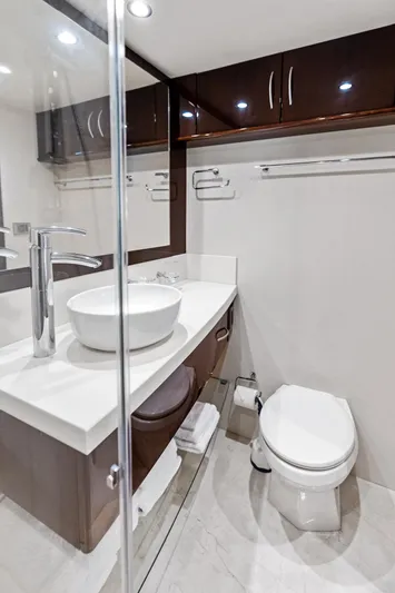 Liquid Asset Yacht Photos Pics Luxurious bathroom in 2010 Lazzara 78 Fly yacht with modern fixtures and elegant design.