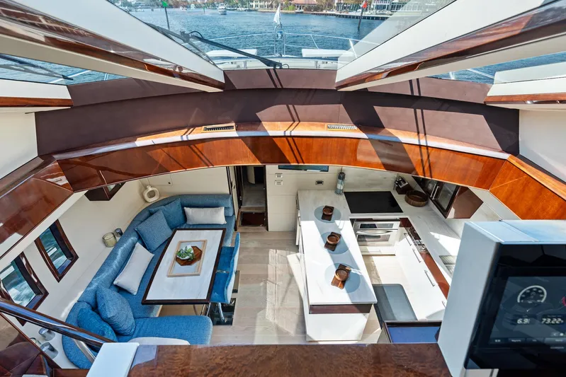 Liquid Asset Yacht Photos Pics Luxurious interior of 2010 Lazzara 78 Fly yacht with modern kitchen and seating area.