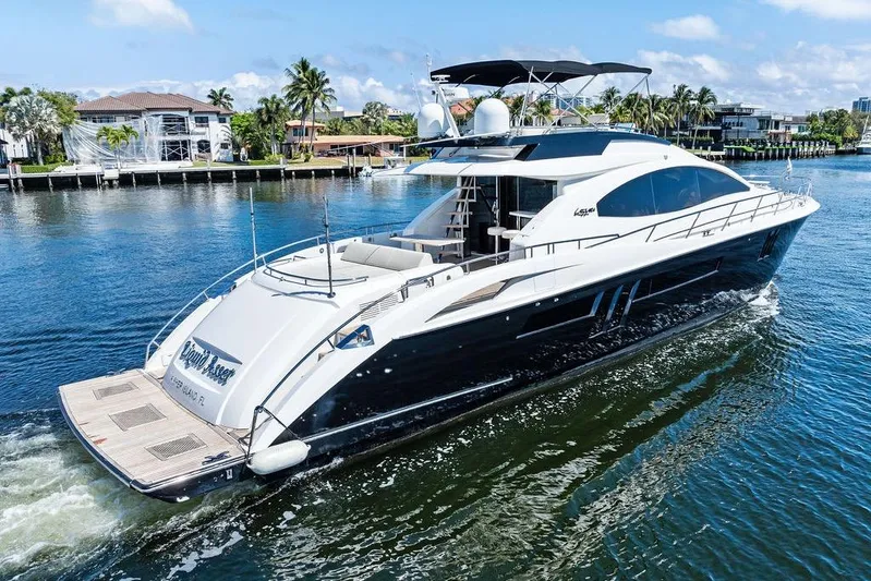 Liquid Asset Yacht Photos Pics Luxury 2010 Lazzara 78 Fly yacht cruising on a sunny day.