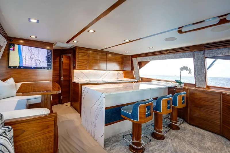 La Barca Yacht Photos Pics Luxurious interior of 2024 Viking 68 Convertible yacht with modern kitchen and ocean view.