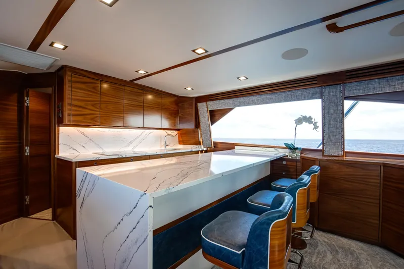 La Barca Yacht Photos Pics Luxurious interior of 2024 Viking 68 Convertible yacht with elegant wood and marble finishes.