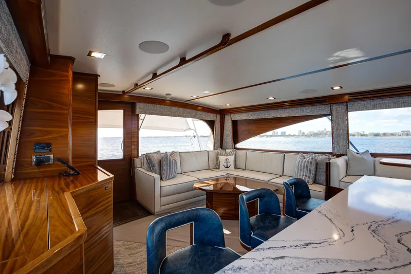 La Barca Yacht Photos Pics Luxurious interior of 2024 Viking 68 Convertible yacht with elegant seating and ocean view.