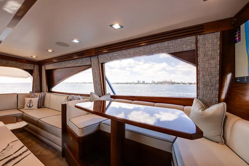 La Barca Yacht Photos Pics Luxurious interior of 2024 Viking 68 Convertible yacht with ocean view.
