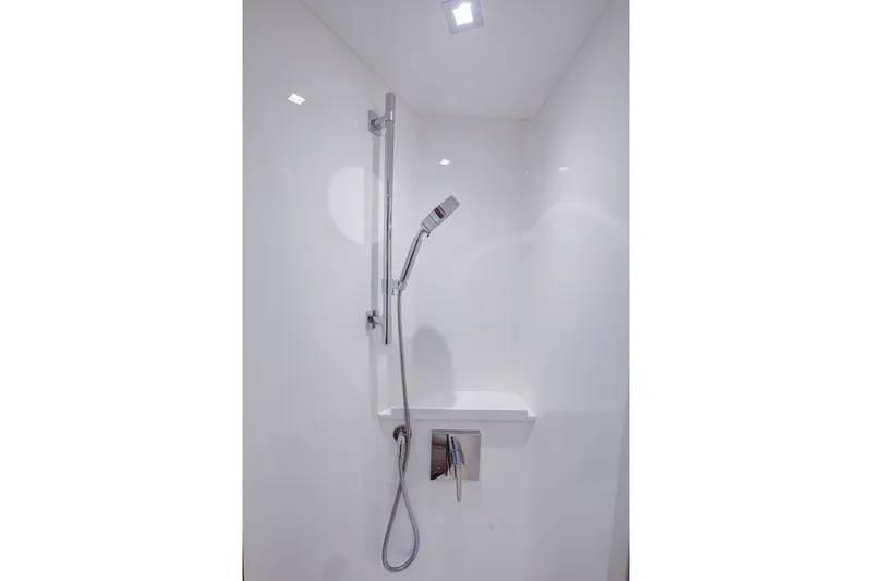 La Barca Yacht Photos Pics Modern shower in 2024 Viking 68 Convertible yacht, featuring sleek chrome fixtures.