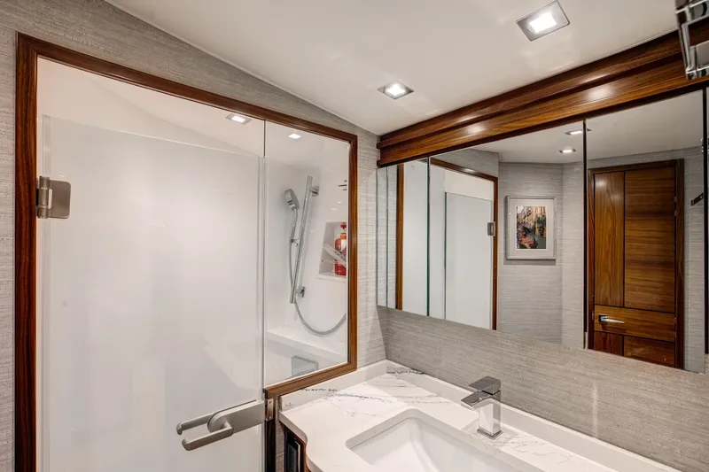 La Barca Yacht Photos Pics Luxurious bathroom in 2024 Viking 68 Convertible yacht with modern fixtures and elegant design.